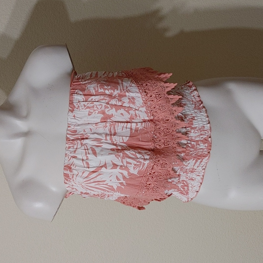 Have lace ruffle sleeveless shirt size small.